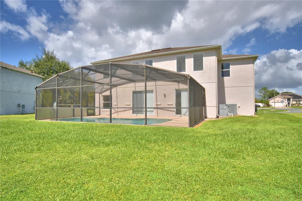 5368 Dahlia Reserve Drive Kissimmee, FL 34758 - Photo 77 of 83 a view of a house with backyard and garden