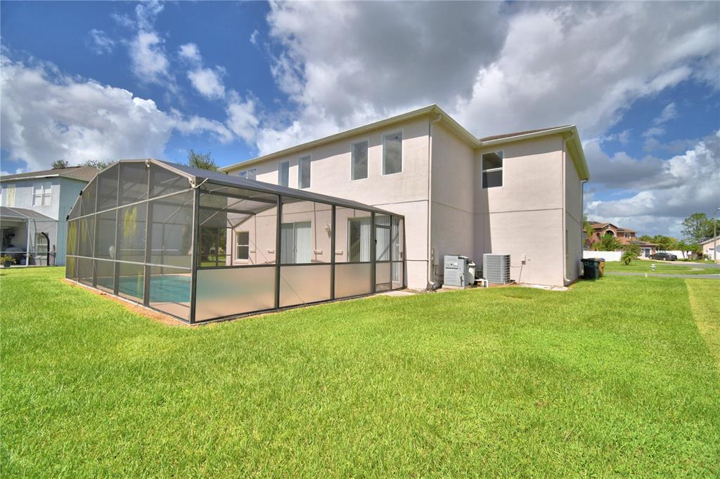 5368 Dahlia Reserve Drive Kissimmee, FL 34758 - Photo 78 of 83 a view of an house with backyard and garden