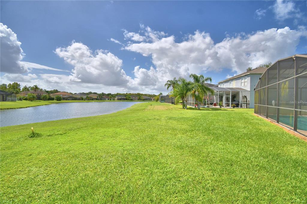 5368 Dahlia Reserve Drive Kissimmee, FL 34758 - Photo 82 of 83 a view of a garden and swimming pool