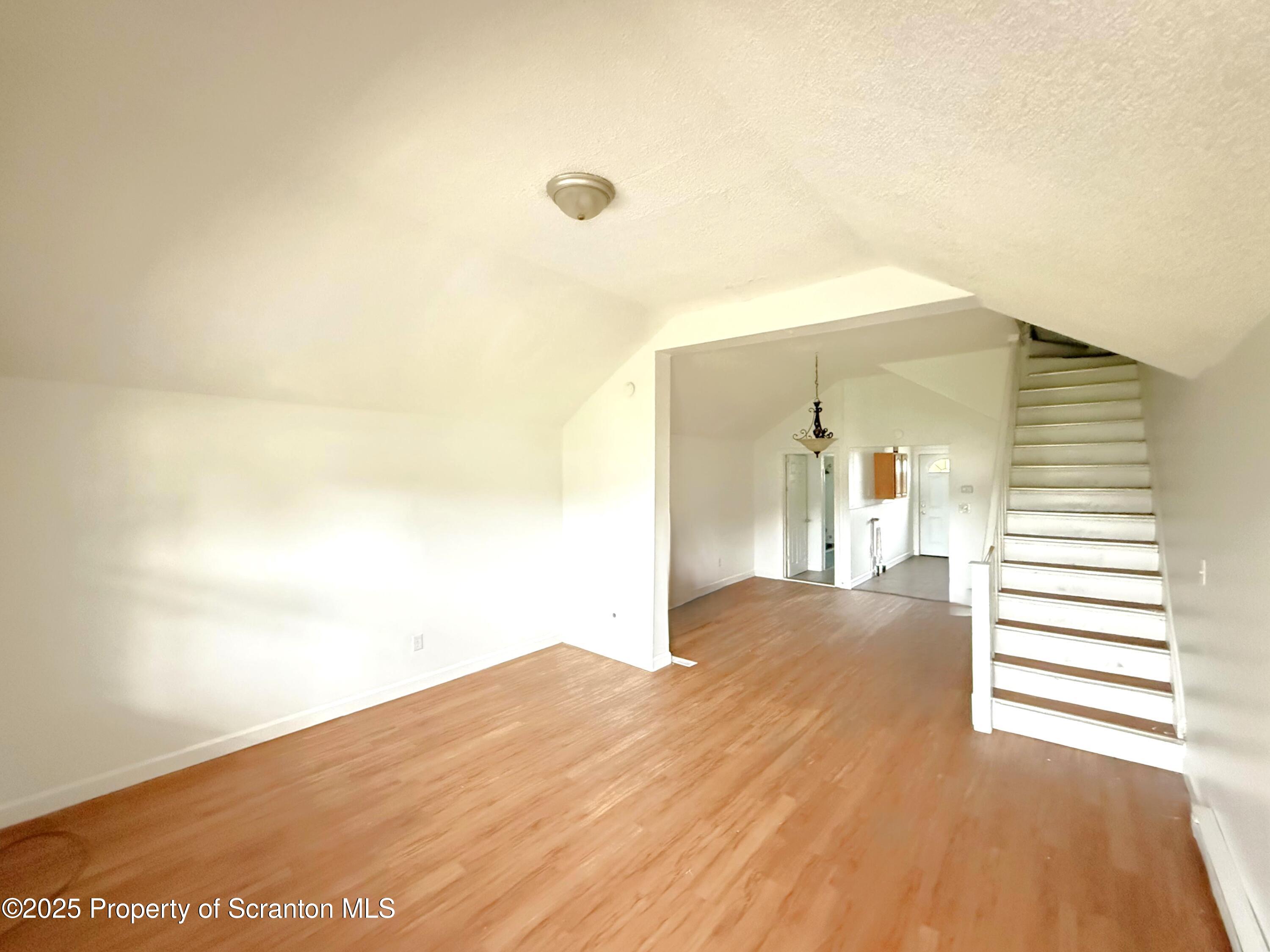 3 Miller Street Pittston, PA 18640 - Photo 3 of 15 a view of a big room with wooden floor and windows