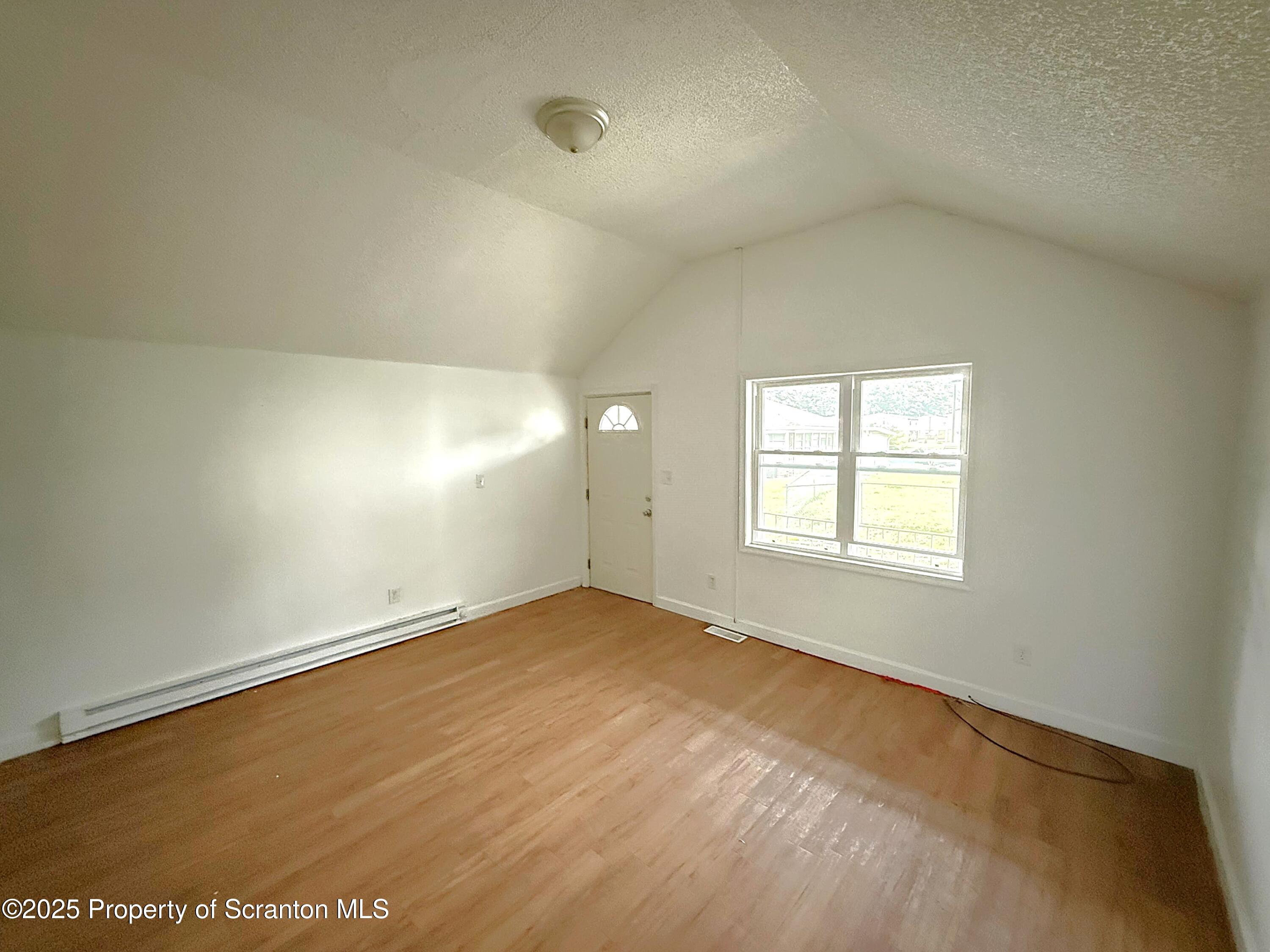 3 Miller Street Pittston, PA 18640 - Photo 4 of 15 an empty room with a empty space and windows