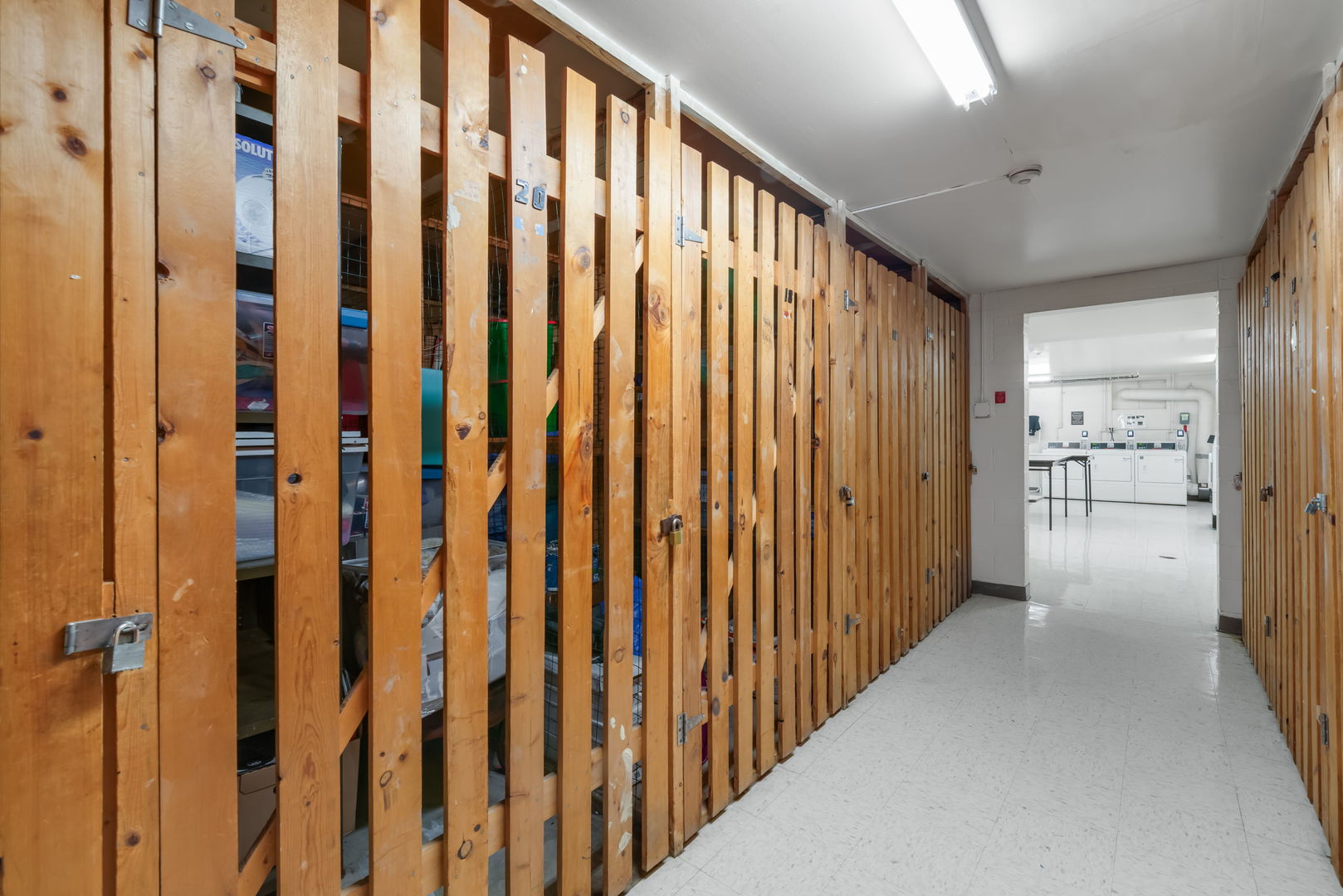 4133 Saratoga Avenue, Unit B220 Downers Grove, IL 60515 - Photo 13 of 18 a view of a hallway with wooden floor