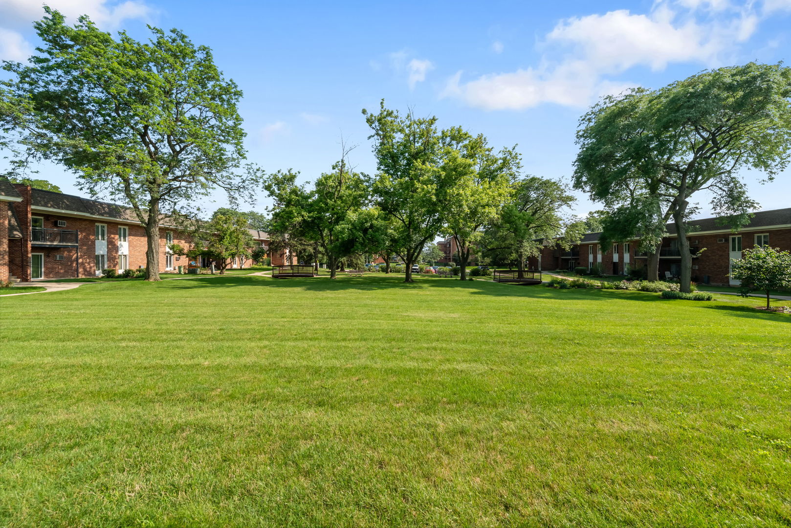 4133 Saratoga Avenue, Unit B220 Downers Grove, IL 60515 - Photo 15 of 18 a view of a park with large trees