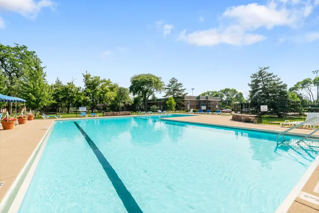 a view of swimming pool with outdoor space and seating area
