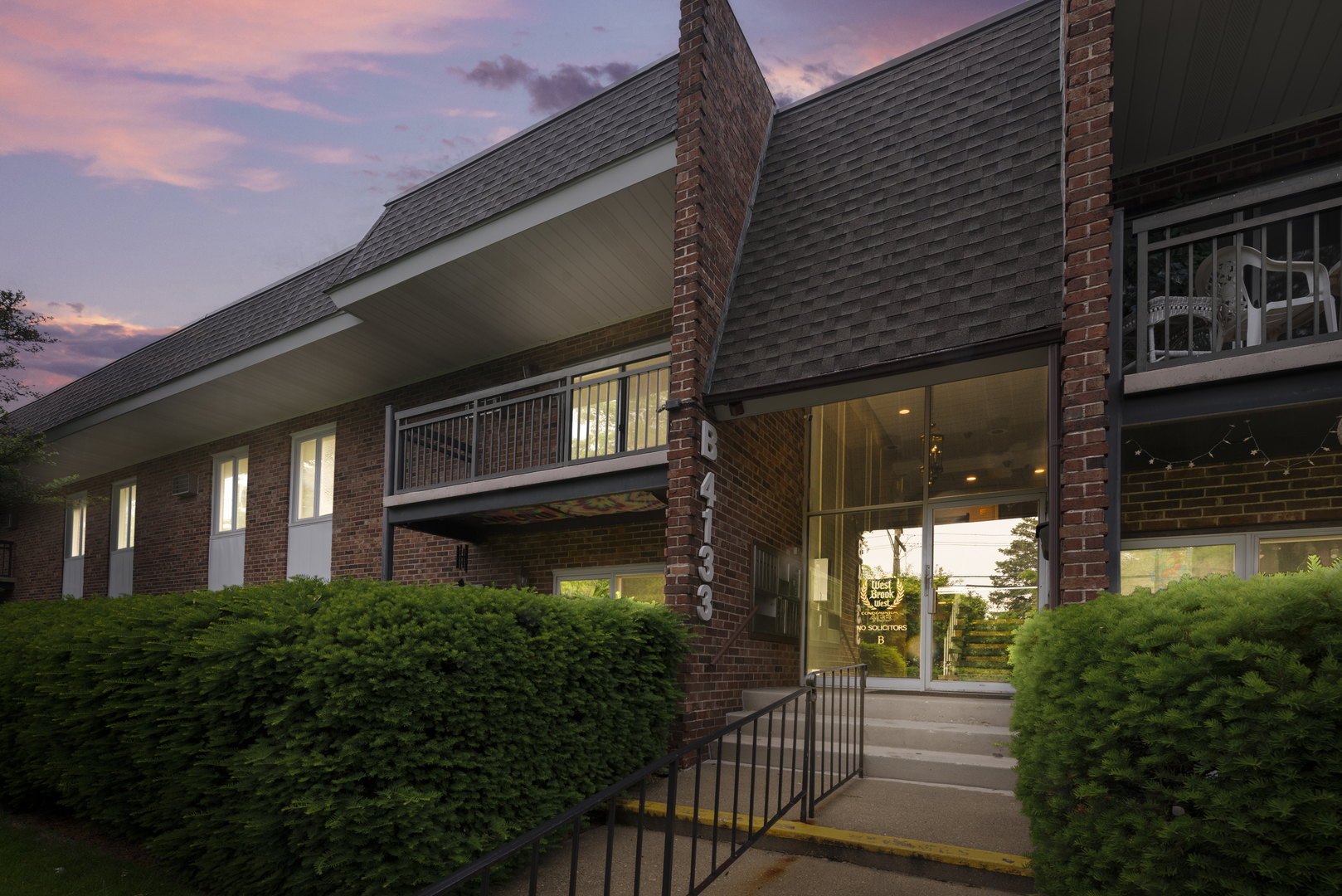 4133 Saratoga Avenue, Unit B220 Downers Grove, IL 60515 - Photo 17 of 18 a view of a house with a small porch