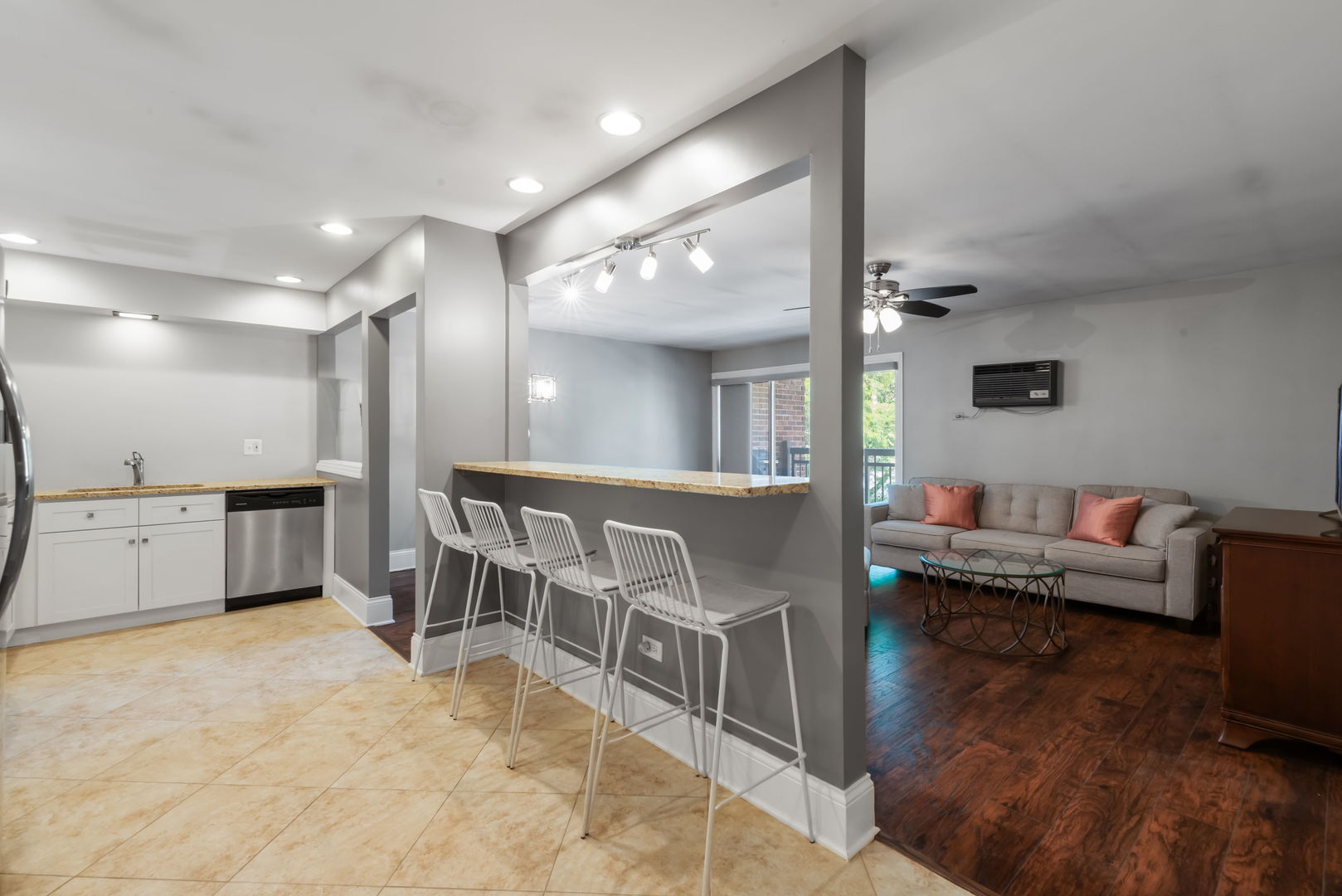 4133 Saratoga Avenue, Unit B220 Downers Grove, IL 60515 - Photo 7 of 18 a living room with furniture and a wooden floor