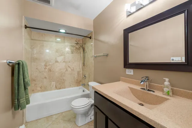 a bathroom with a sink a toilet and a bathtub