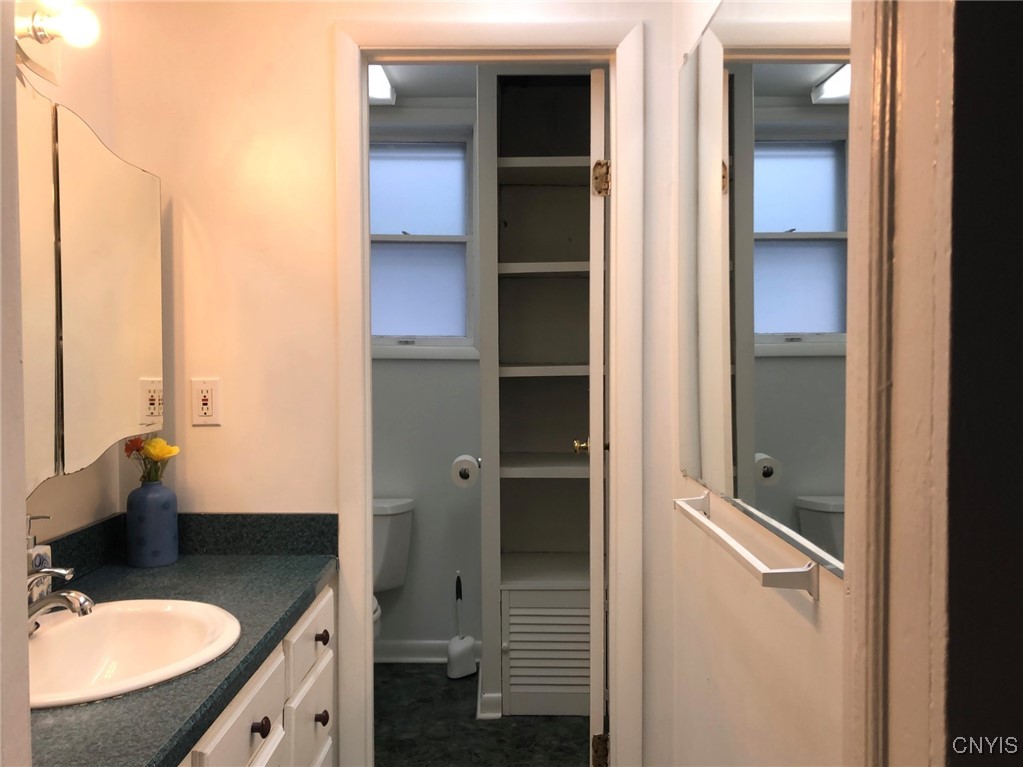 110 Spring Lane Syracuse, NY 13208 - Photo 22 of 40 vanity rm entrance to full bath on 1st floor