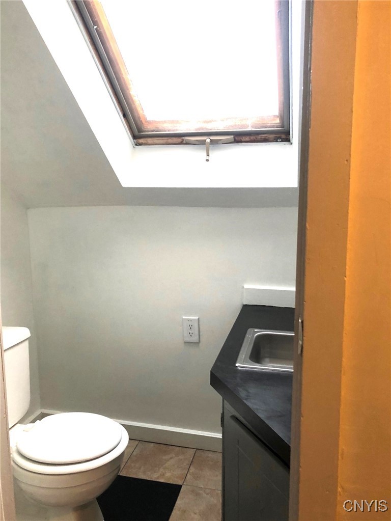 110 Spring Lane Syracuse, NY 13208 - Photo 30 of 40 2nd Floor half Bath with skylight