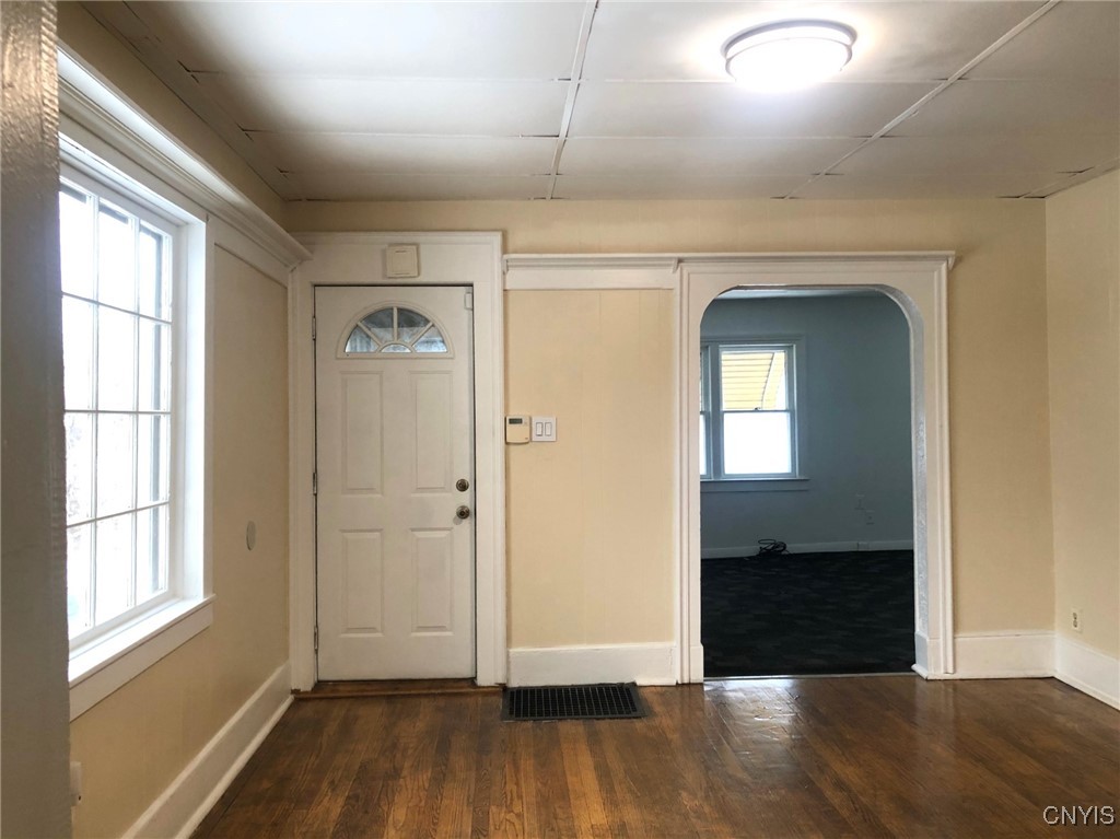 110 Spring Lane Syracuse, NY 13208 - Photo 7 of 40 Dining Room showing Entrance door and opening to t