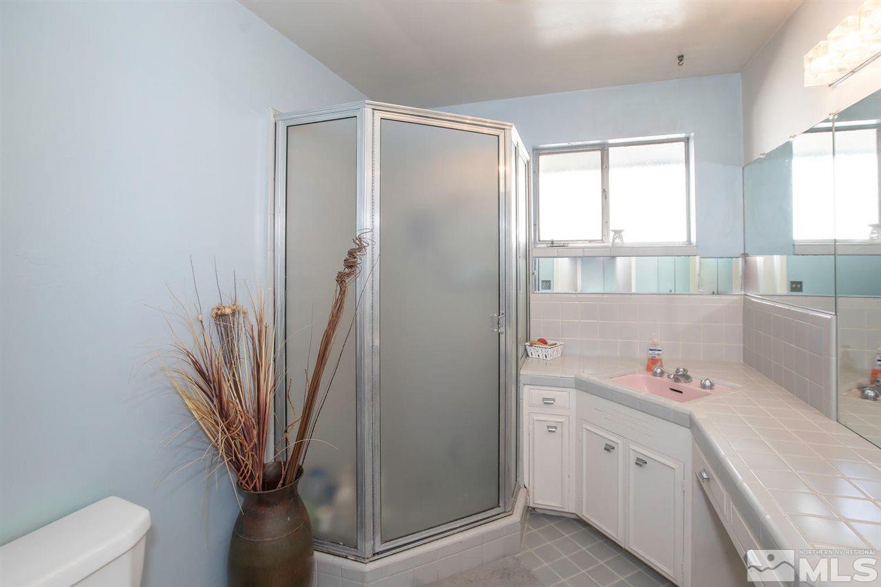 2320 Watt Street Reno, NV 89509 - Photo 11 of 25 a bathroom with a sink a toilet and a bathtub
