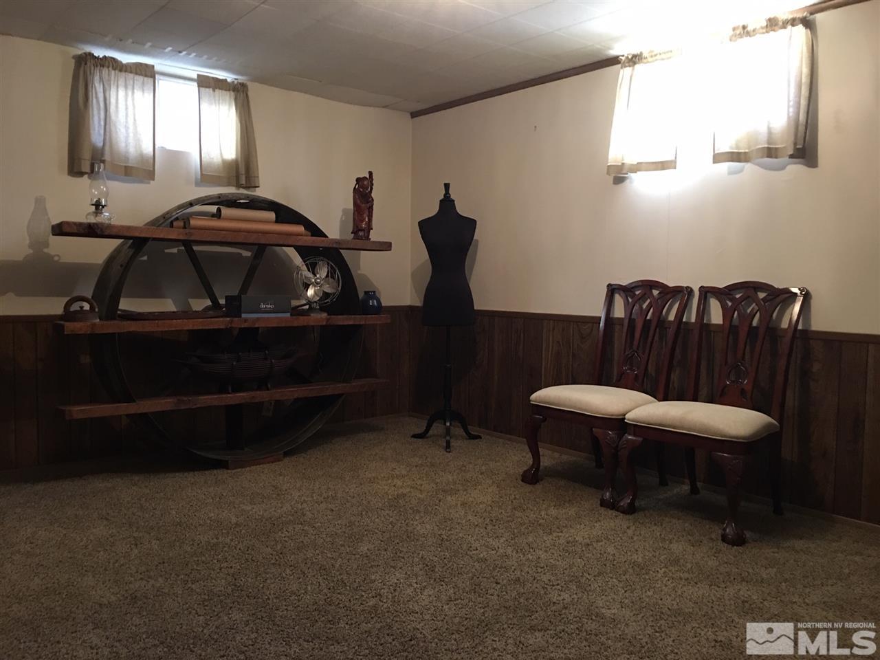2320 Watt Street Reno, NV 89509 - Photo 17 of 25 a living room with furniture a window and a lamp