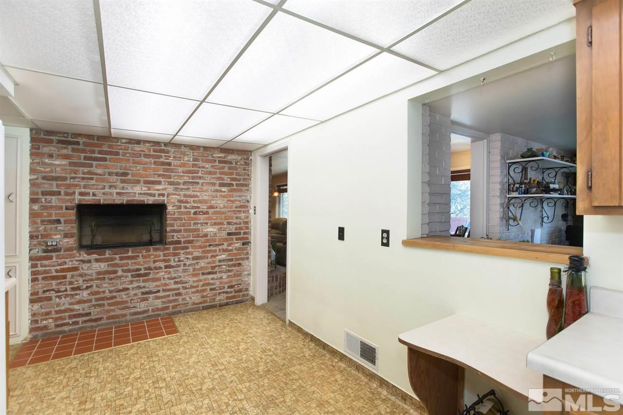 2320 Watt Street Reno, NV 89509 - Photo 7 of 25 a view of a refrigerator in kitchen and wooden floor
