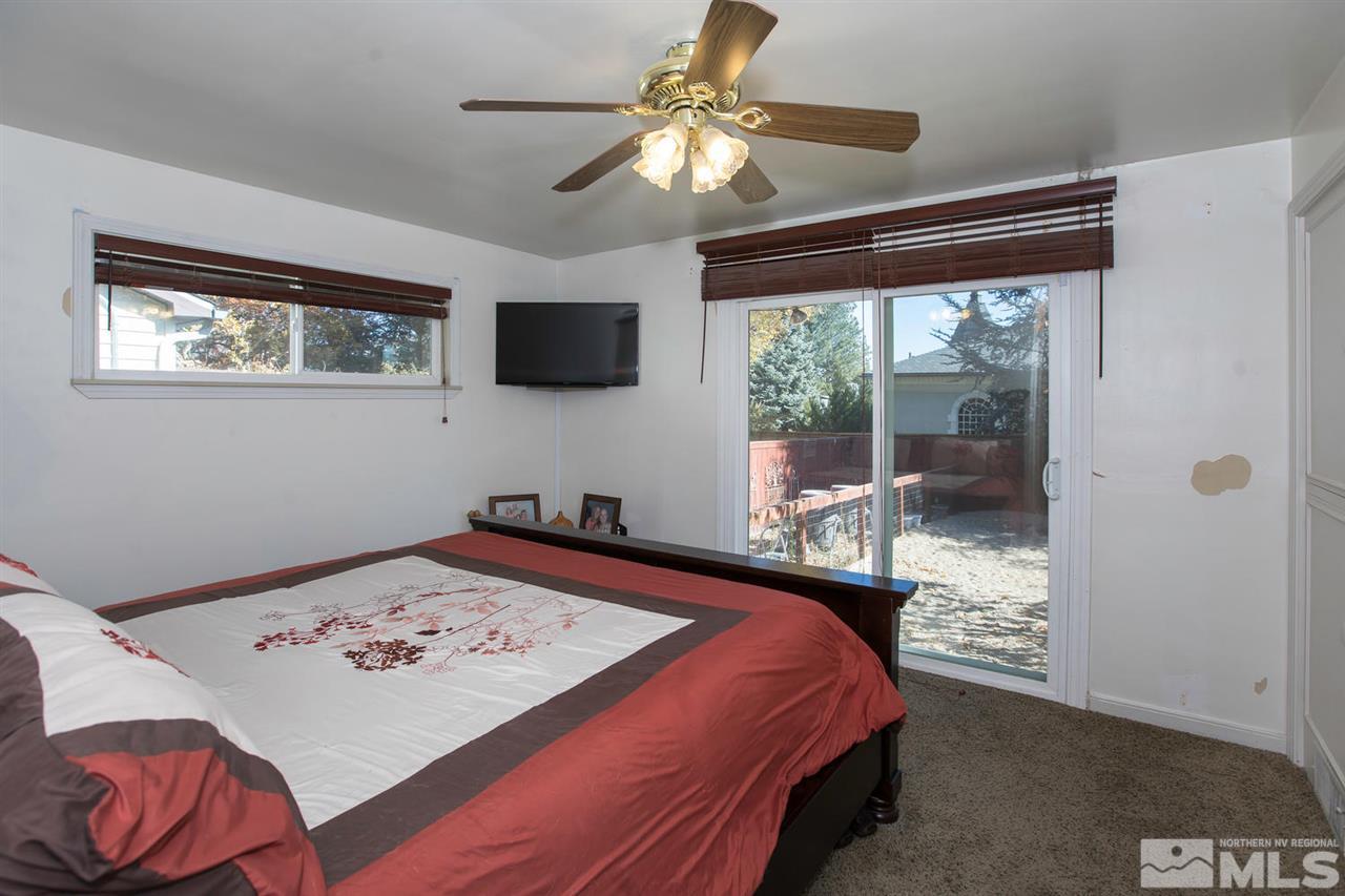2320 Watt Street Reno, NV 89509 - Photo 10 of 25 a bedroom that has a bed and a table in it