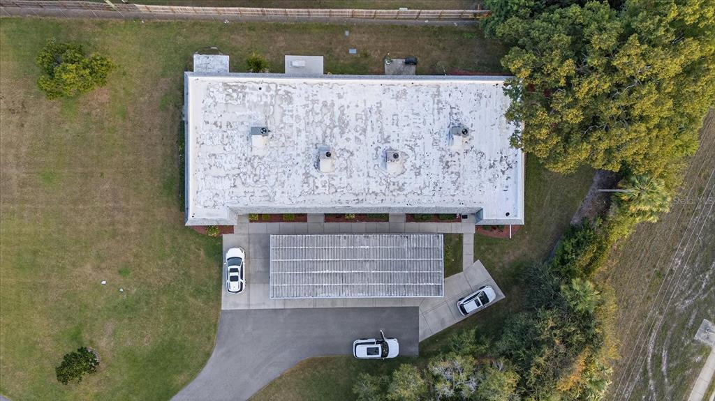 3230 Teeside Drive New Port Richey, FL 34655 - Photo 31 of 32 an aerial view of a house with a yard and a fountain