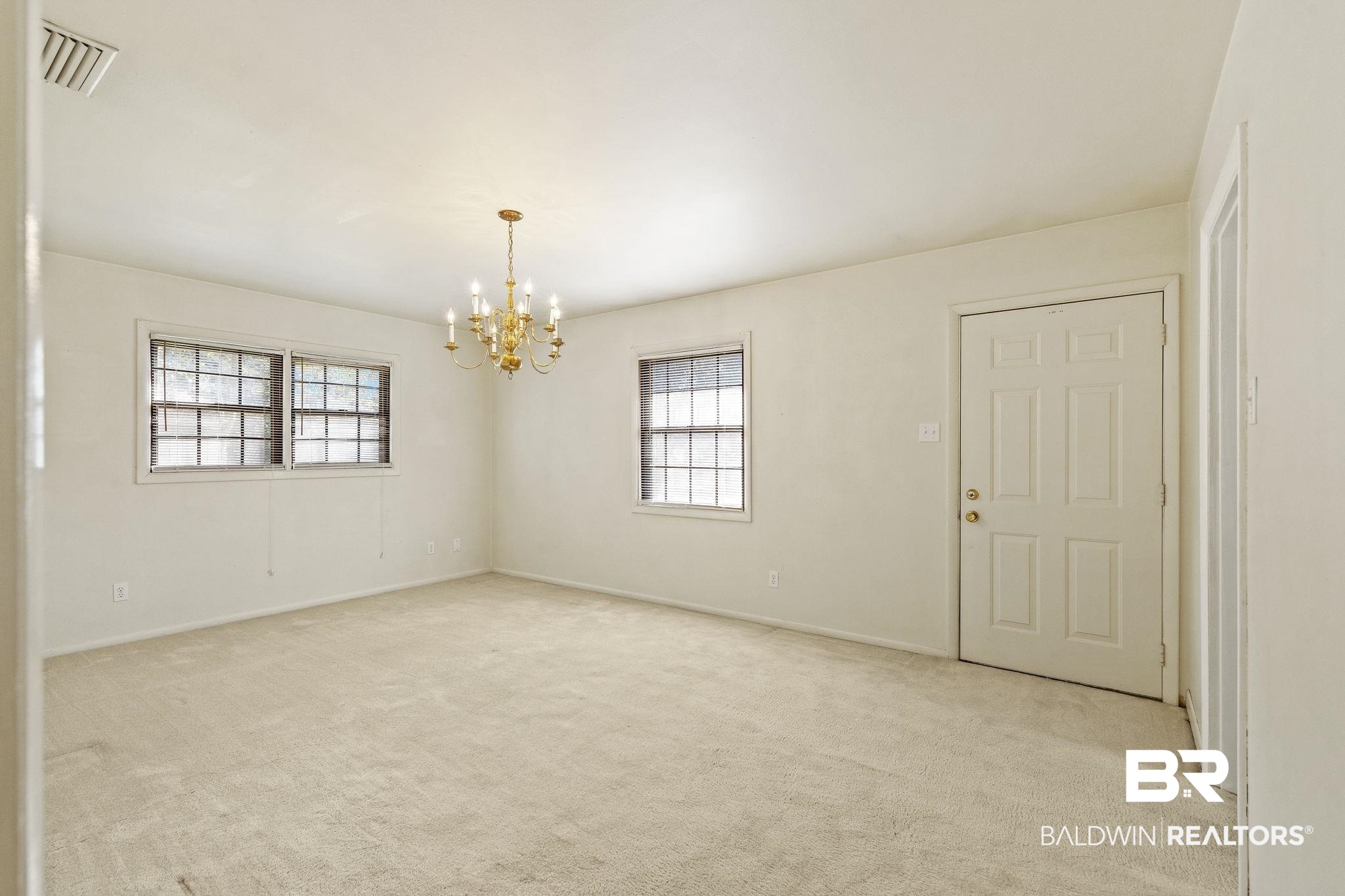 4366 Barden Avenue Mobile, AL 36619 - Photo 40 of 40 Unfurnished room with a notable chandelier and light colored carpet