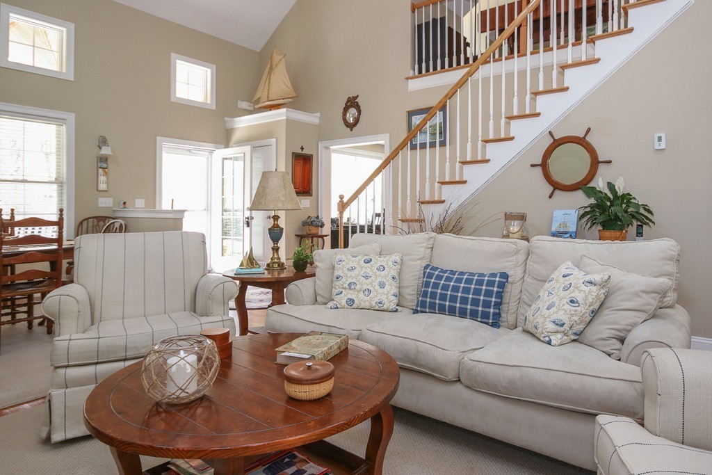 18 Cherry Blossom Way, Unit 48 Hanover, MA 02339 - Photo 4 of 24 a living room with furniture and wooden floor
