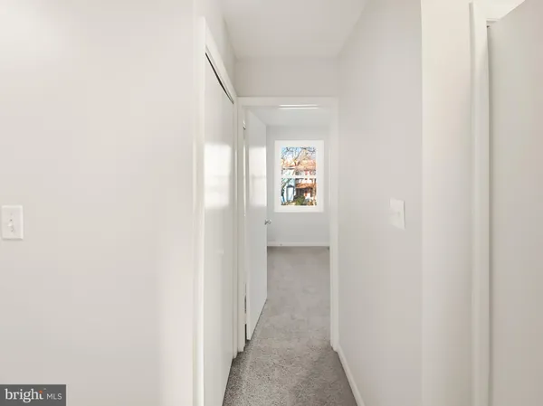 a view of a hallway with windows