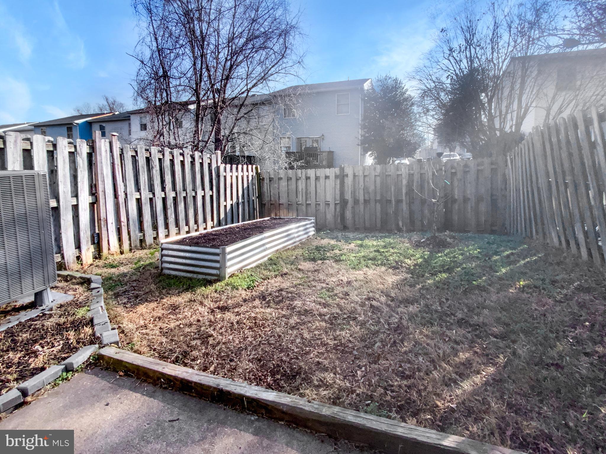 5132 Redbud Road Fredericksburg, VA 22407 - Photo 17 of 19 a view of backyard with wooden fence