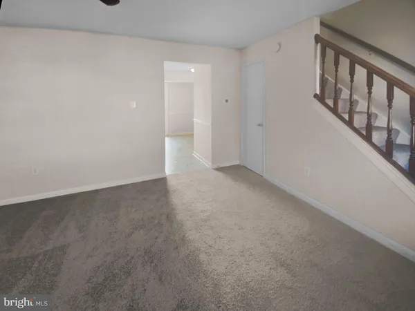a view of an empty room with windows