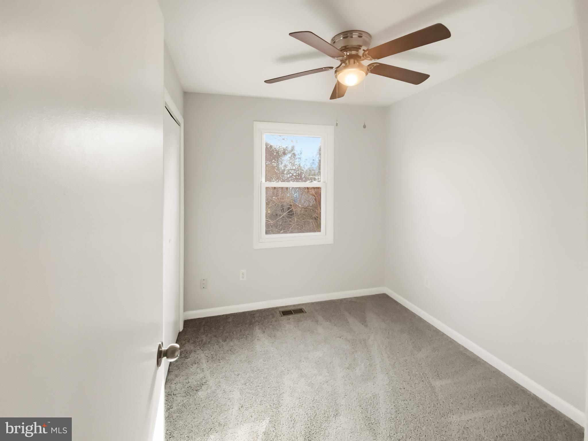 5132 Redbud Road Fredericksburg, VA 22407 - Photo 10 of 19 an empty room with a window and a fan