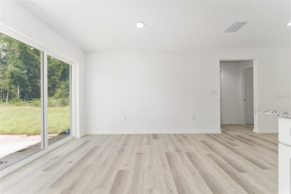 319 Fisher Road Ocklawaha, FL 32179 - Photo 12 of 48 a view of wooden floor and brick walls