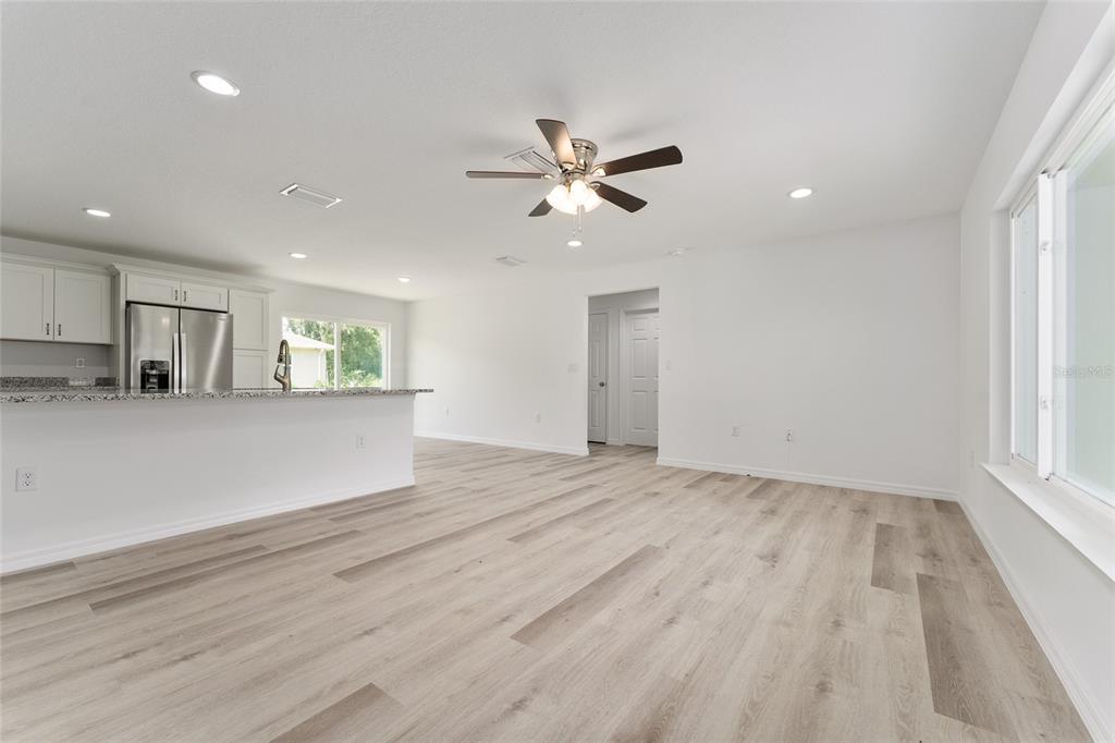 319 Fisher Road Ocklawaha, FL 32179 - Photo 22 of 48 a view of a kitchen with a sink and a window