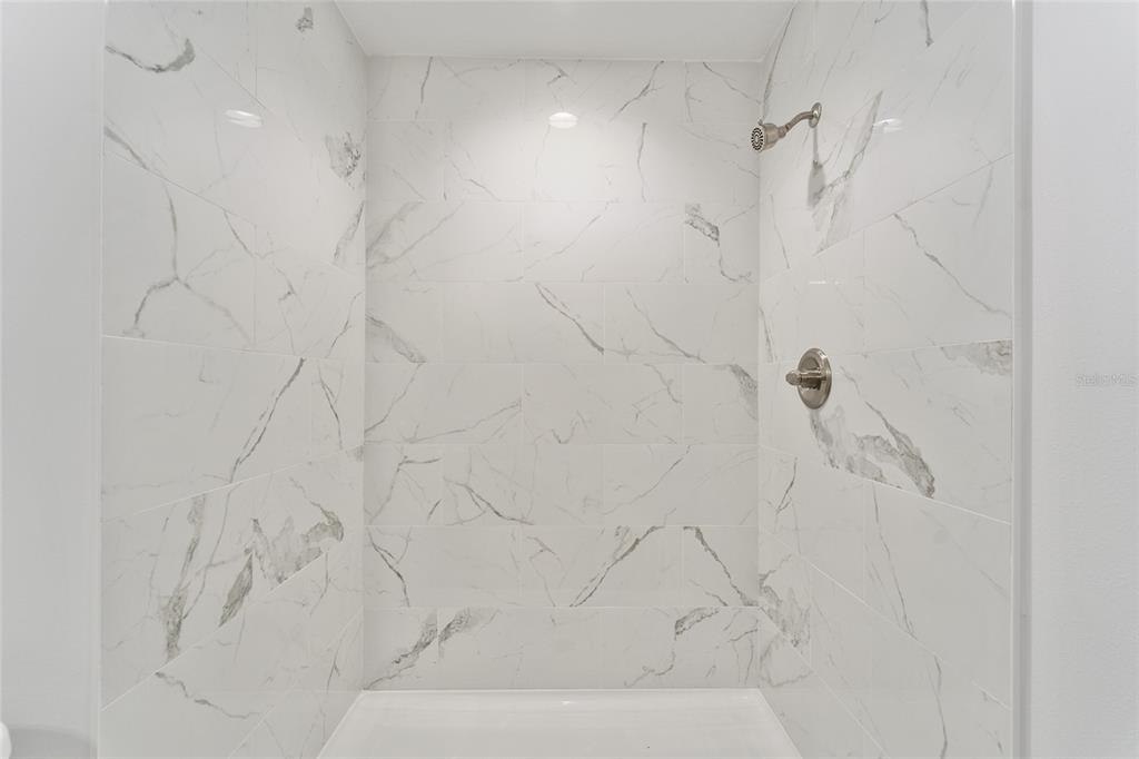 319 Fisher Road Ocklawaha, FL 32179 - Photo 28 of 48 a bathroom with a shower