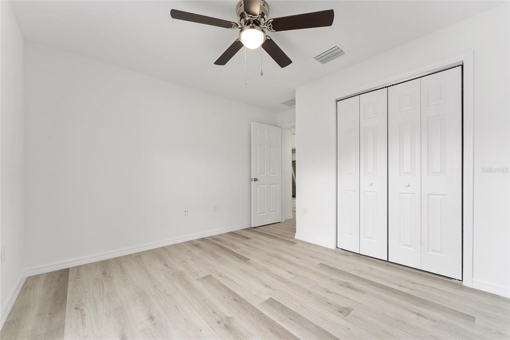 319 Fisher Road Ocklawaha, FL 32179 - Photo 36 of 48 a view of an empty room and chandelier fan