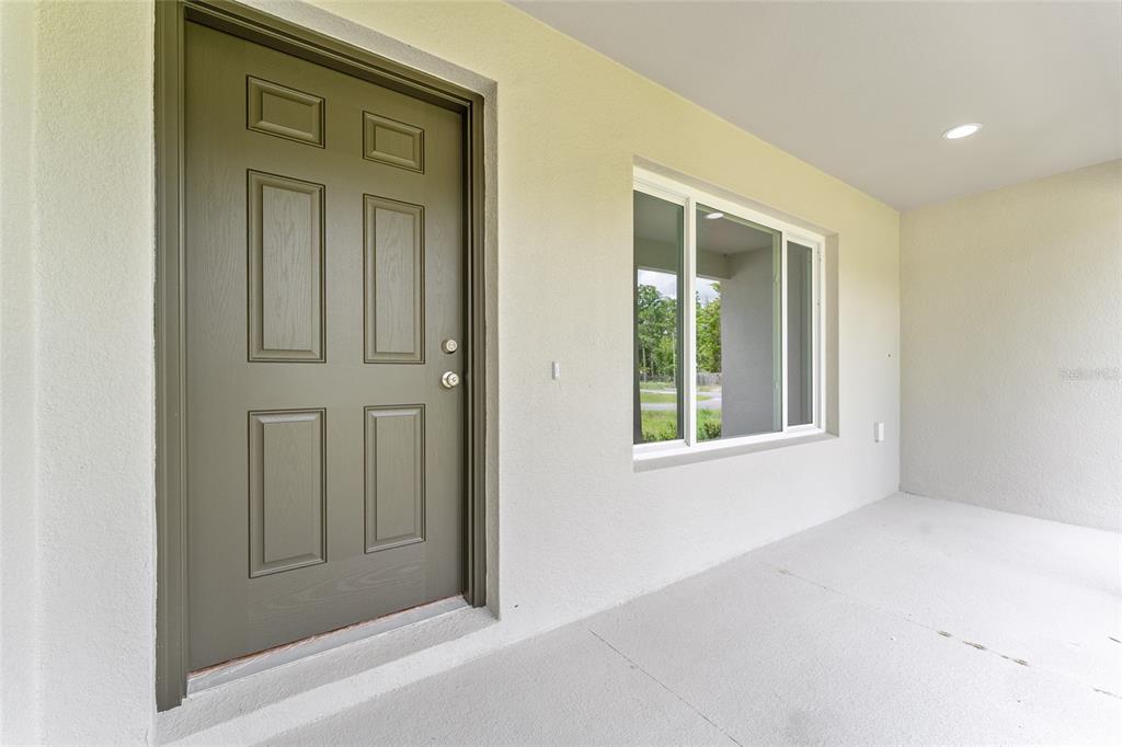 319 Fisher Road Ocklawaha, FL 32179 - Photo 4 of 48 view of empty room with windows