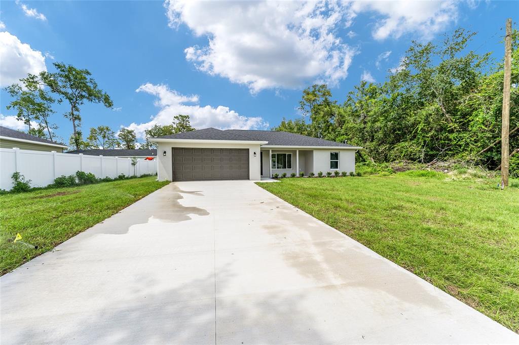 319 Fisher Road Ocklawaha, FL 32179 - Photo 42 of 48 a view of house with a big yard