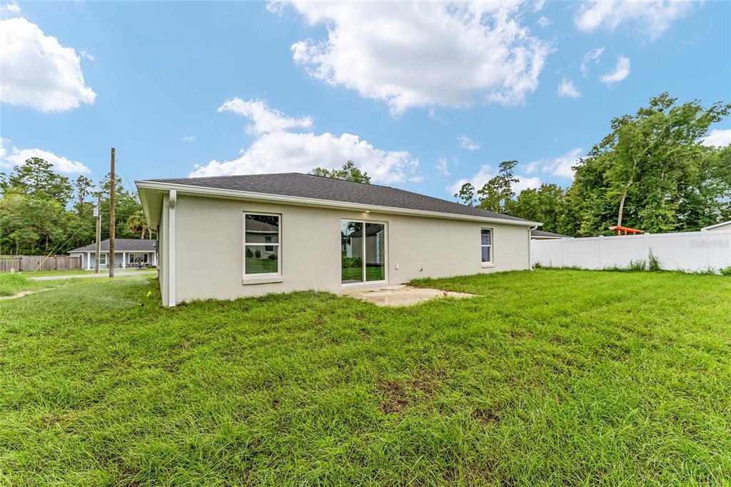 319 Fisher Road Ocklawaha, FL 32179 - Photo 48 of 48 a view of backyard with kitchen