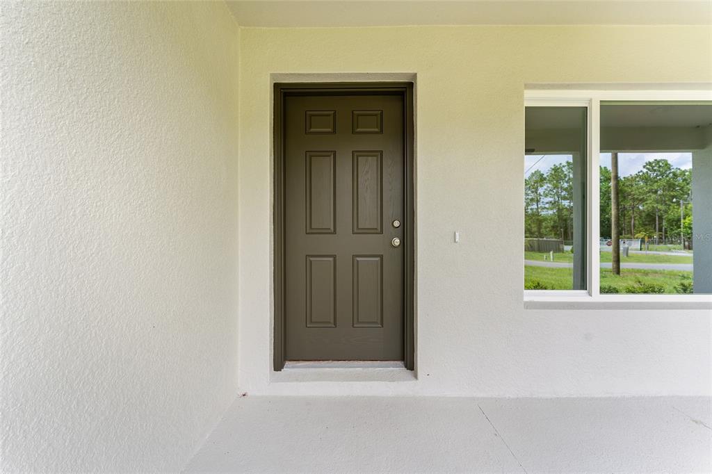 319 Fisher Road Ocklawaha, FL 32179 - Photo 5 of 48 wooden floor and window in an empty room