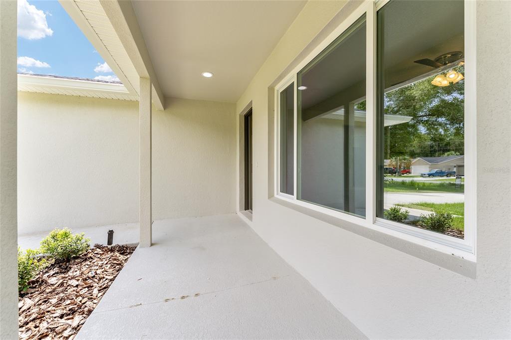 319 Fisher Road Ocklawaha, FL 32179 - Photo 7 of 48 a view of a large window with an outdoor space