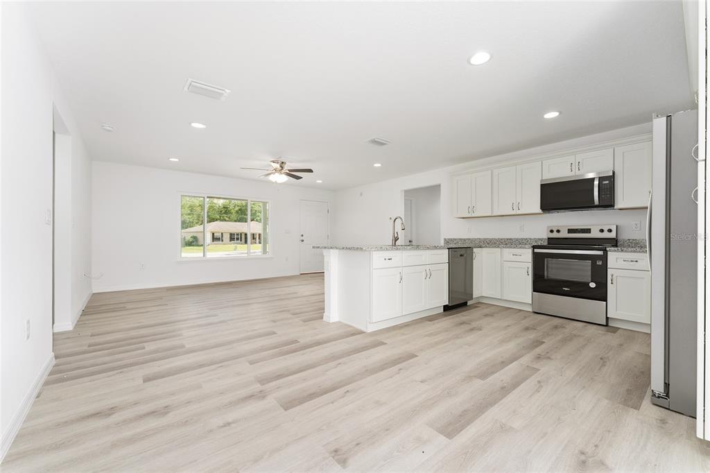 319 Fisher Road Ocklawaha, FL 32179 - Photo 10 of 48 a view of kitchen with microwave and cabinets