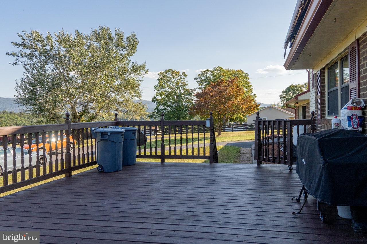 212 Whitacre Road Gore, VA 22637 - Photo 11 of 100 a view of a chairs and tables on the wooden deck