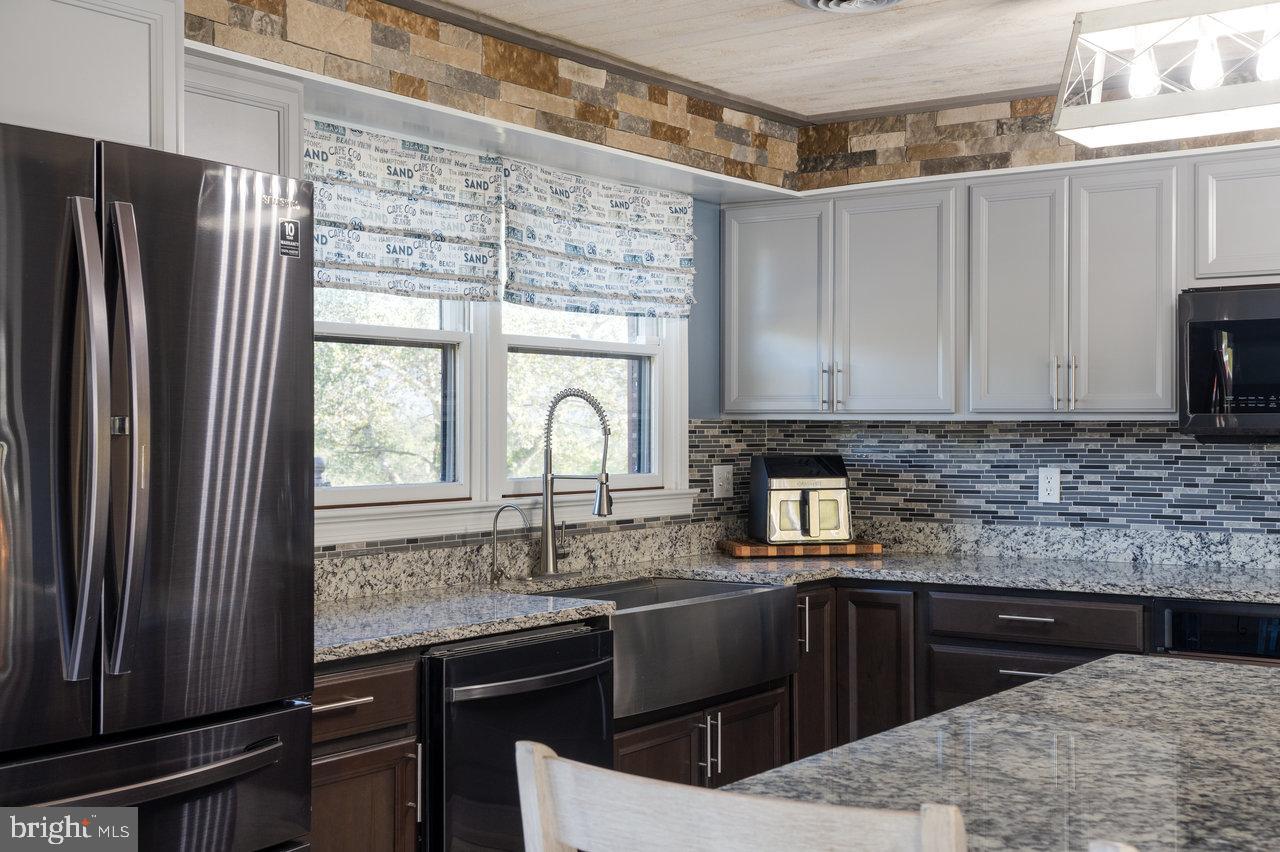 212 Whitacre Road Gore, VA 22637 - Photo 16 of 100 Modern kitchen with sleek finishes and style.