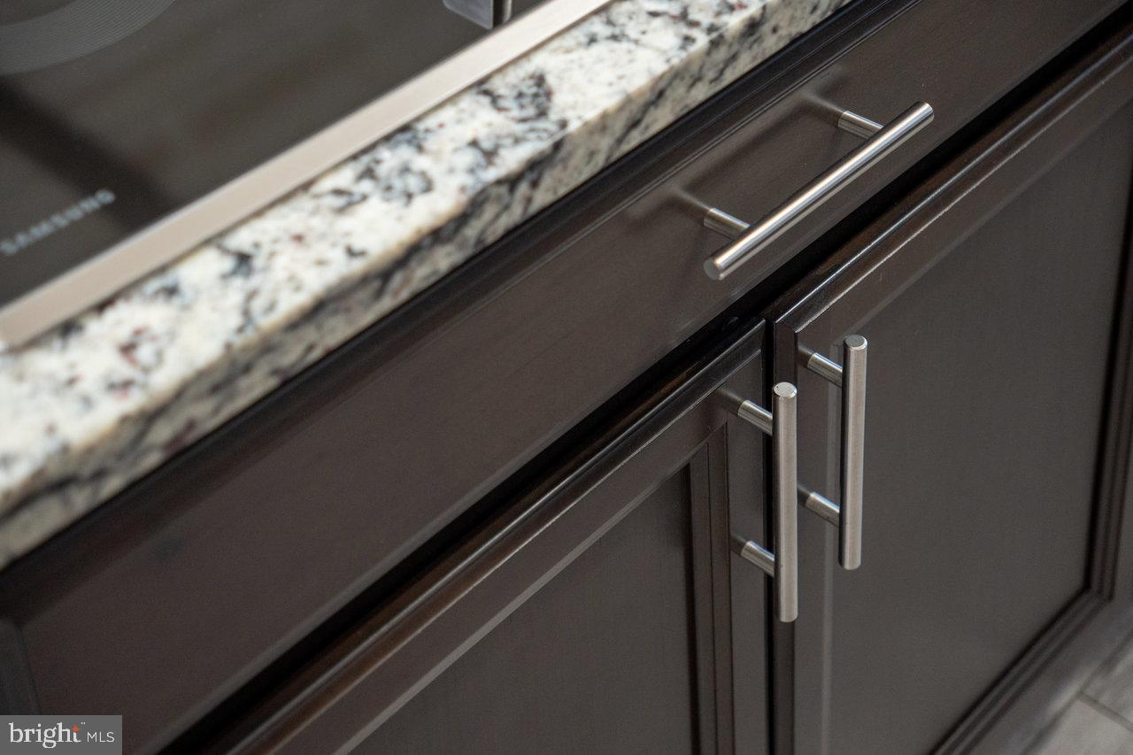 212 Whitacre Road Gore, VA 22637 - Photo 23 of 100 Sleek cabinetry with elegant granite top.