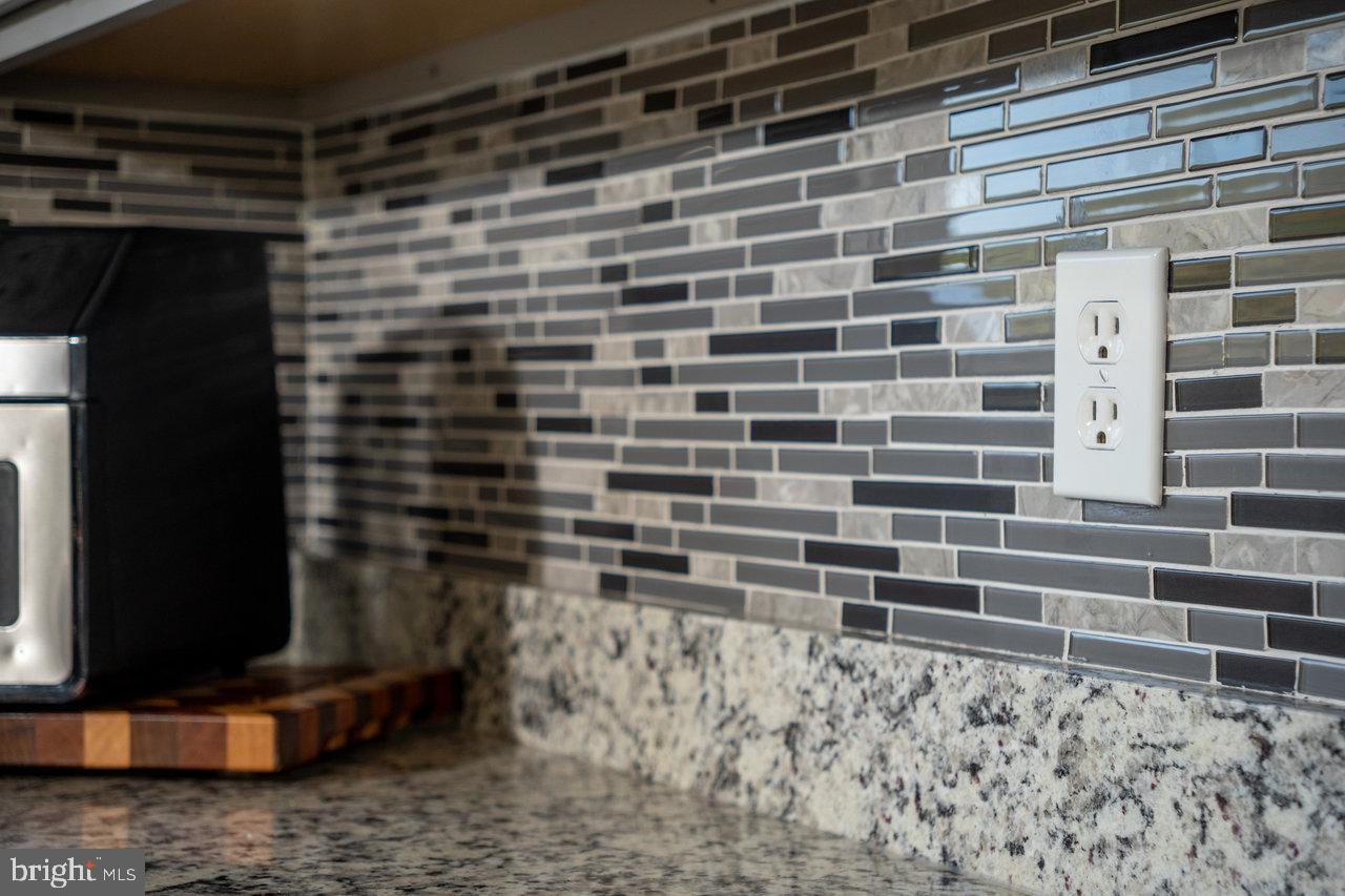 212 Whitacre Road Gore, VA 22637 - Photo 25 of 100 Sleek kitchen with modern tile accents.