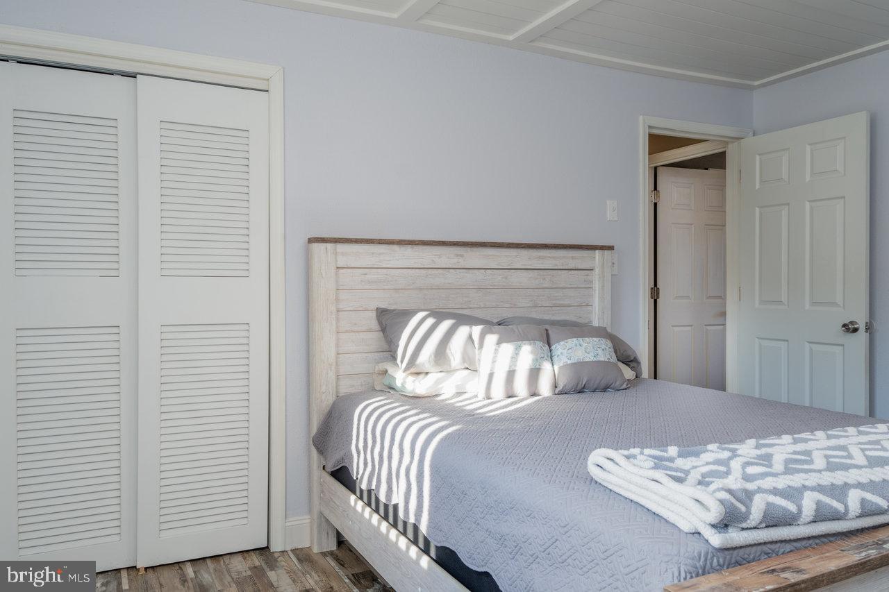 212 Whitacre Road Gore, VA 22637 - Photo 46 of 100 a bedroom with a bed and a night stand