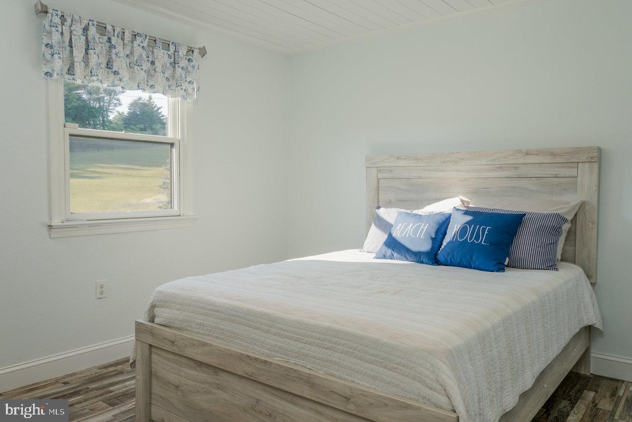 212 Whitacre Road Gore, VA 22637 - Photo 48 of 100 a bedroom with a bed and a window
