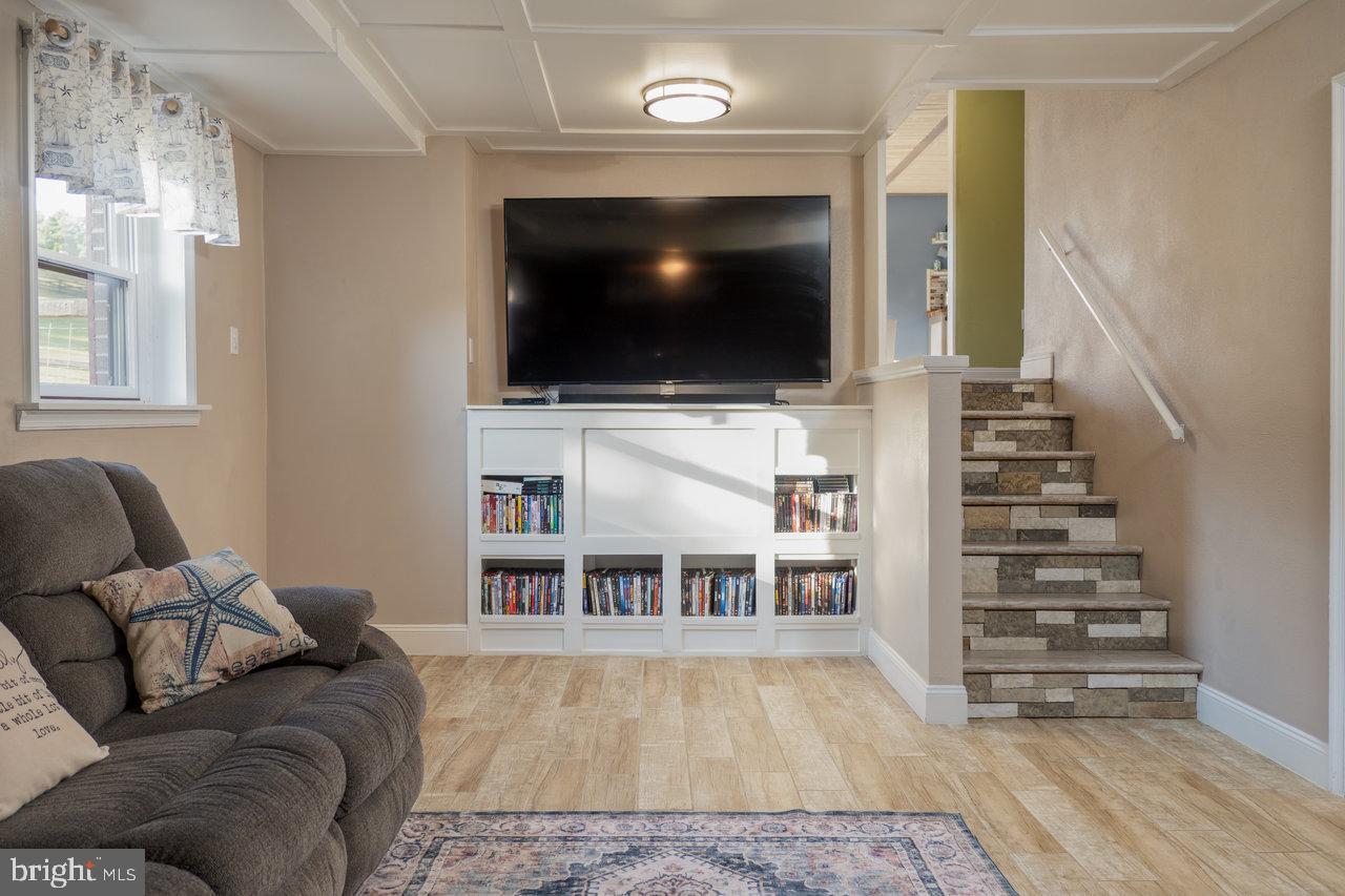 212 Whitacre Road Gore, VA 22637 - Photo 52 of 100 a living room with furniture and a flat screen tv