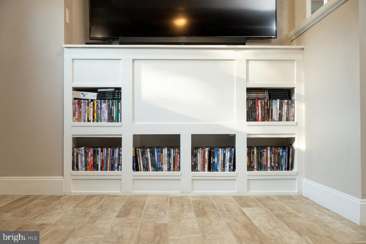 212 Whitacre Road Gore, VA 22637 - Photo 54 of 100 a living room with a bed and a book shelf