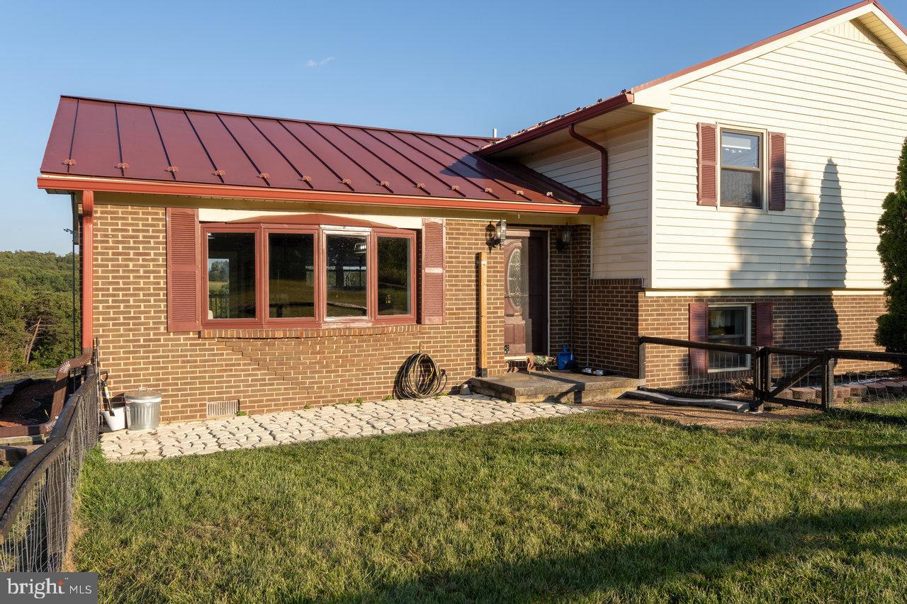 212 Whitacre Road Gore, VA 22637 - Photo 67 of 100 a group of people sitting in front of a house
