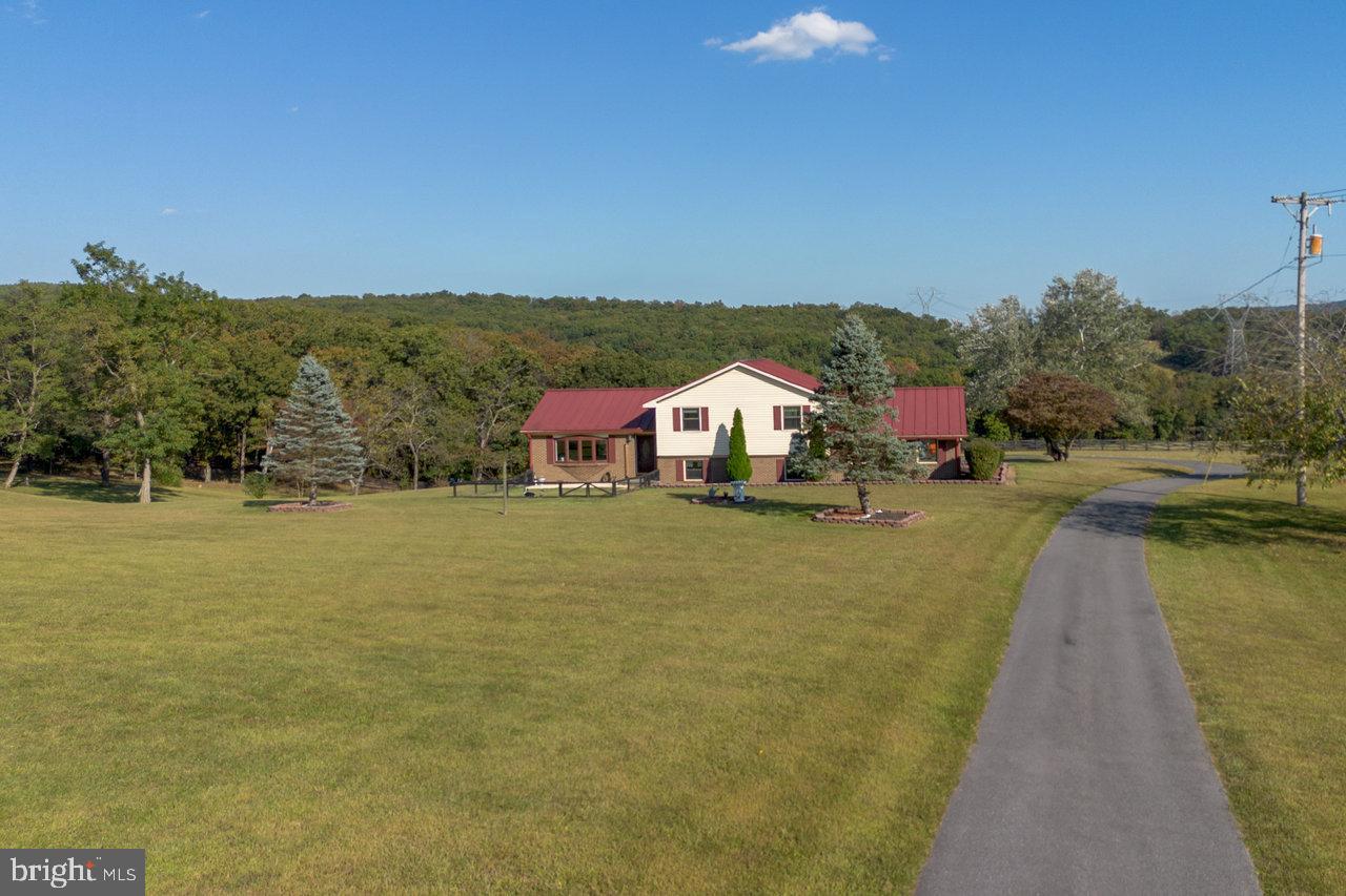 212 Whitacre Road Gore, VA 22637 - Photo 76 of 100 a view of a lake with a houses in the background