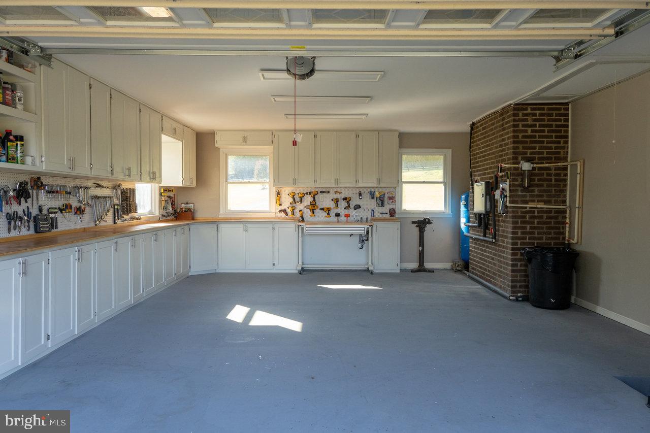 212 Whitacre Road Gore, VA 22637 - Photo 81 of 100 a kitchen with stainless steel appliances a sink stove and cabinets
