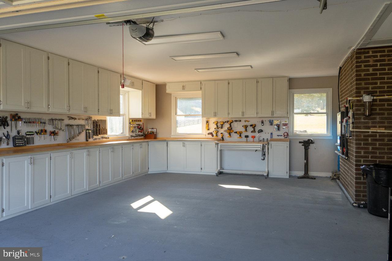 212 Whitacre Road Gore, VA 22637 - Photo 82 of 100 a kitchen with granite countertop a stove a sink and a refrigerator