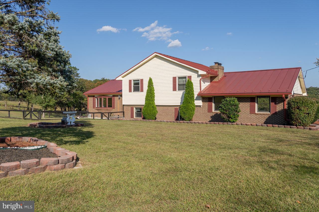 212 Whitacre Road Gore, VA 22637 - Photo 87 of 100 a front view of a house with garden
