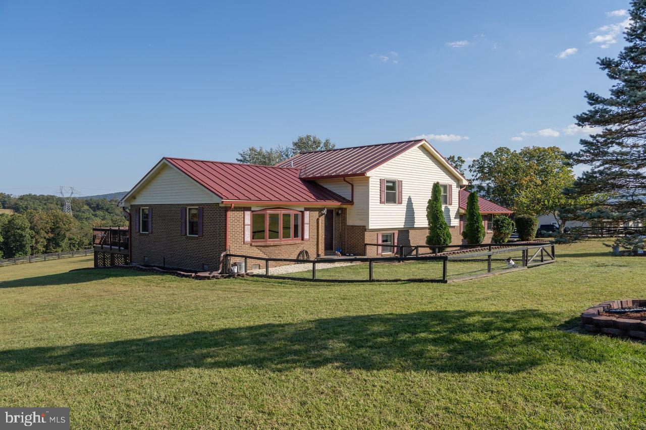 212 Whitacre Road Gore, VA 22637 - Photo 89 of 100 a front view of a house with garden