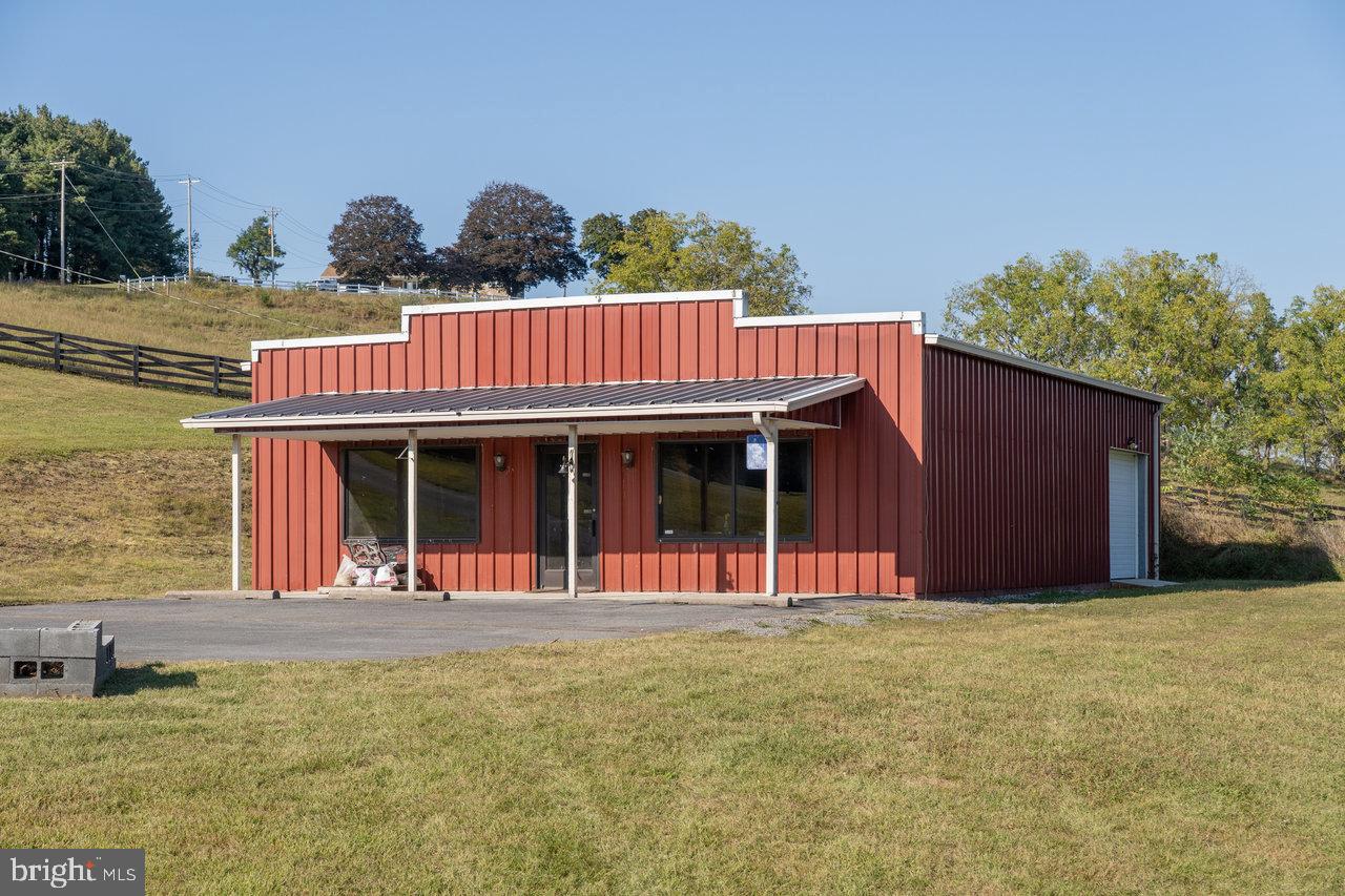 212 Whitacre Road Gore, VA 22637 - Photo 91 of 100 a view of a house with a garden and plants